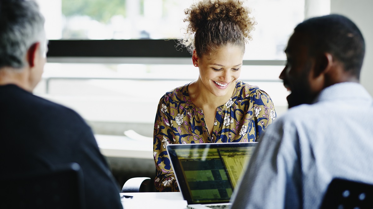 Woman smiling during a meeting